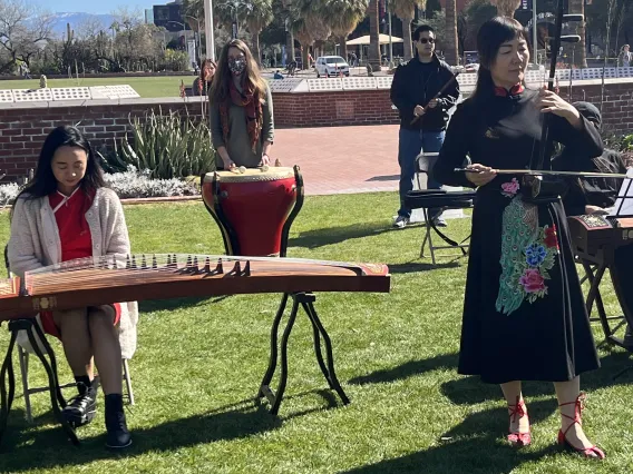 Students playing traditional Chinese instruments